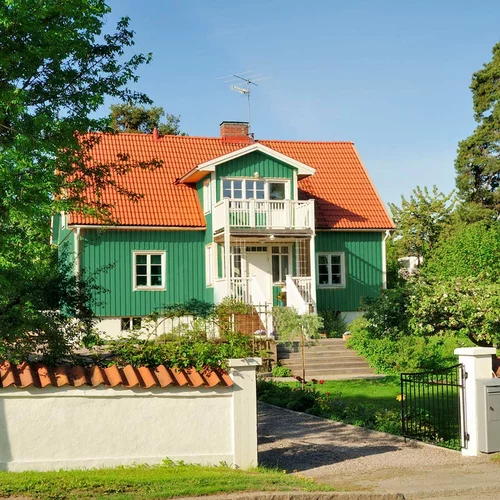 En bild på ett grönt hus.